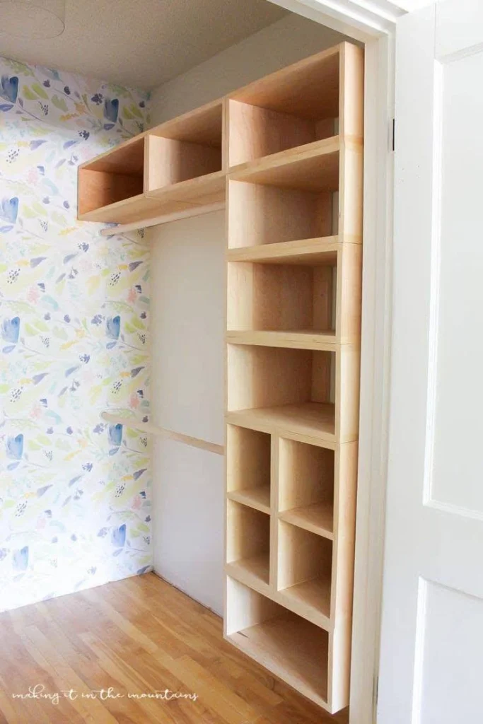 Custom-built wooden shelving inside a closet, maximizing vertical storage space. Home storage solutions.