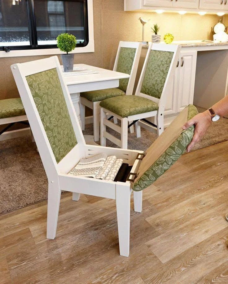 Dining chair with a lift-up seat revealing a hidden storage compartment. Clever home storage hacks.