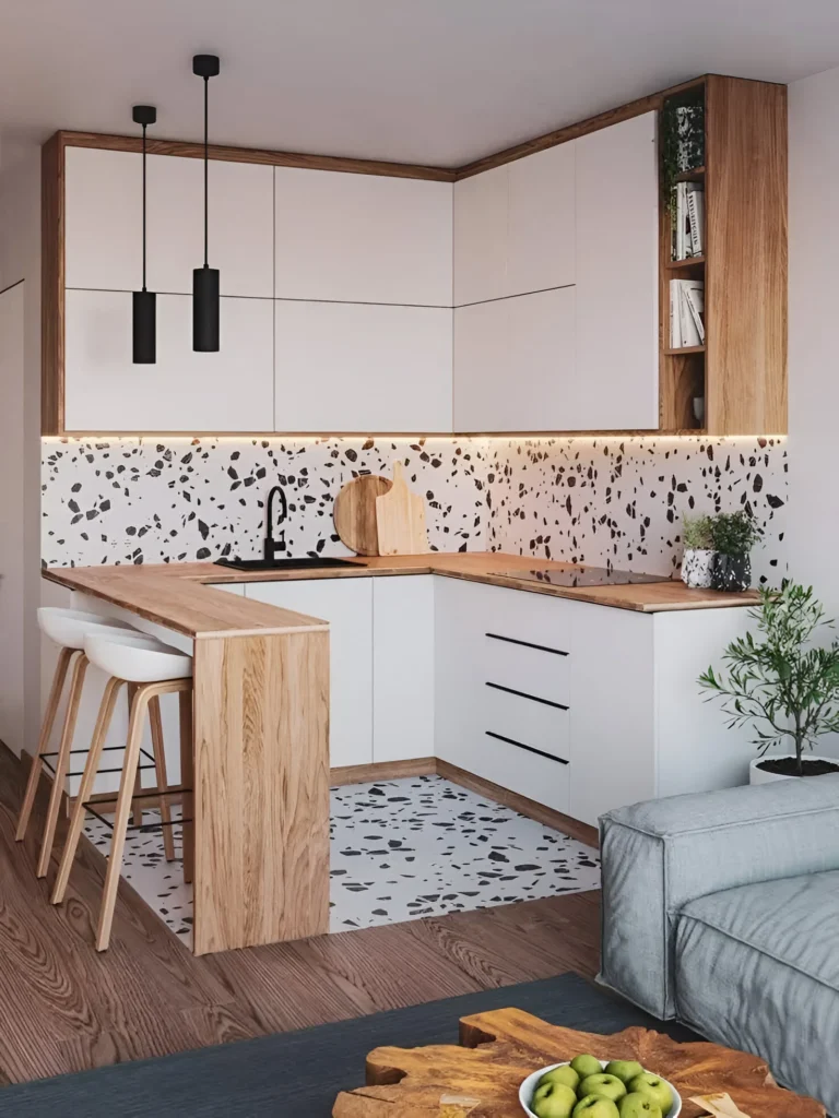 Small kitchen bar with terrazzo backsplash, light wood countertop.