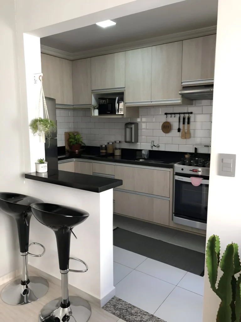 High-gloss black kitchen bar with adjustable chrome stools.