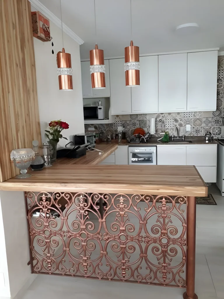 Kitchen bar with ornate metal base and light wood countertop.