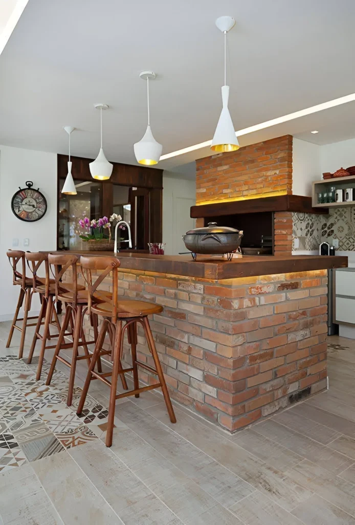 Kitchen bar constructed from exposed brick with wooden stools.