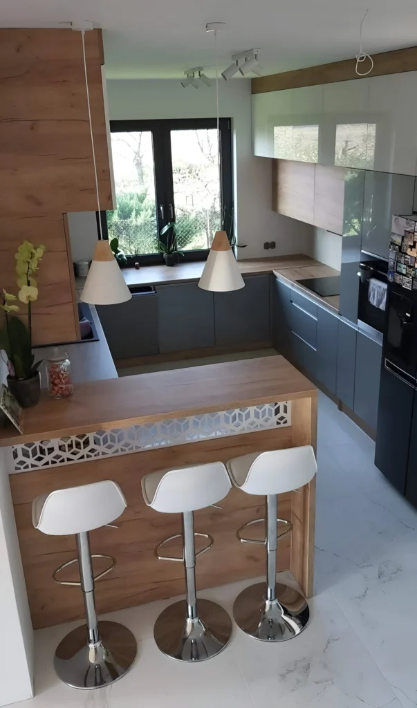 Kitchen bar with geometric cutout design, light wood, and white stools.