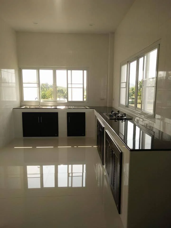 Kitchen with Glossy Surfaces Reflecting Light