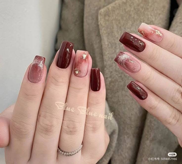 Burgundy Nails with Gradient and Marble Effects