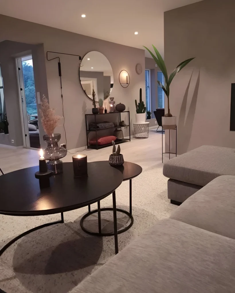 Living room with soft, warm gray walls and natural accents.