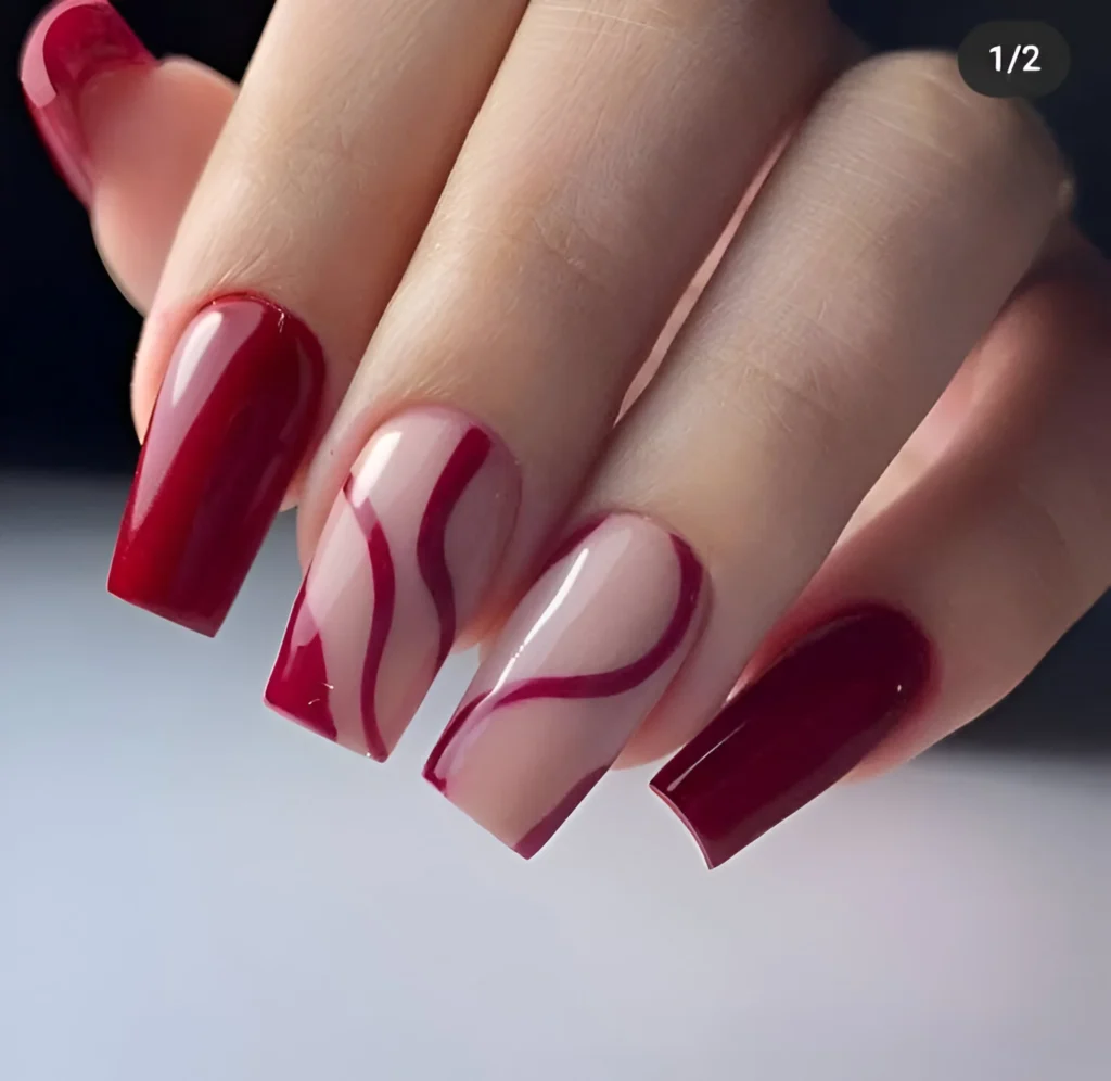 Abstract swirling red lines on nude nails, a unique 2025 nail art design.