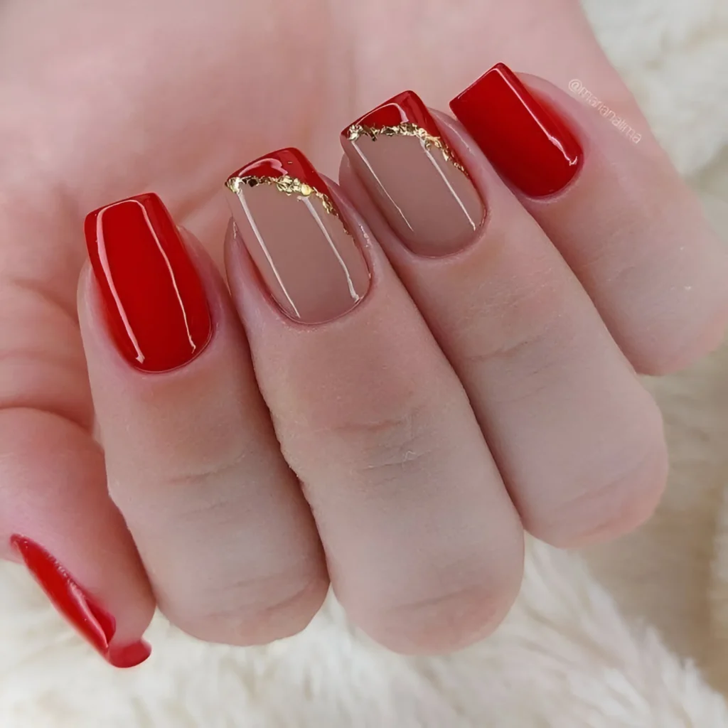 Red and nude nails with gold foil accents, a luxurious design for 2025.