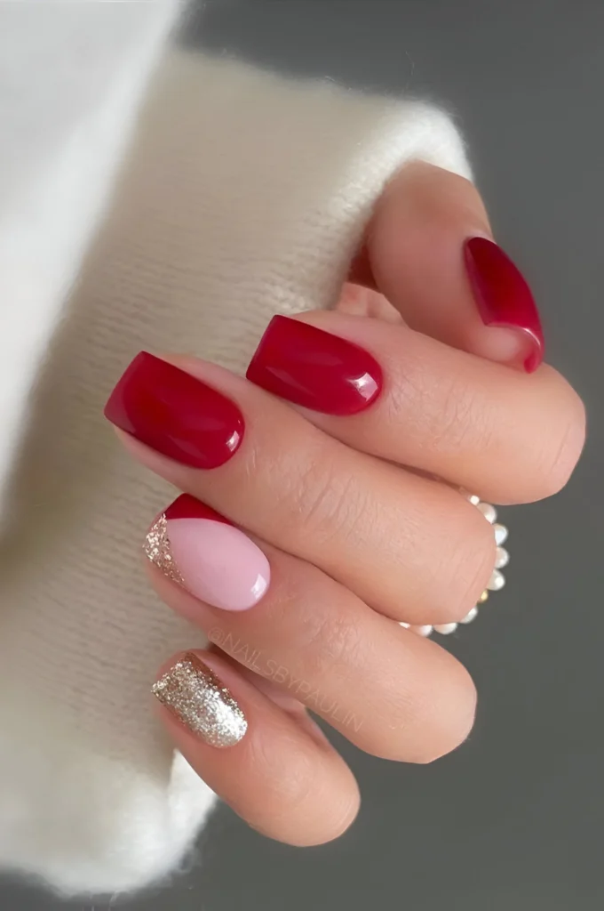 Red, pink, and gold glitter nails - a chic and trendy design for 2025 - Trending red nail designs