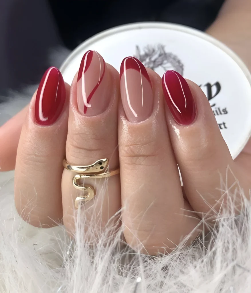 Red French tip nail design, modern twist.