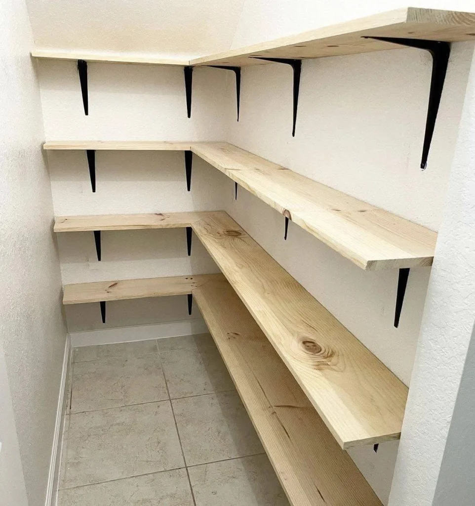 Empty wooden shelves in a kitchen pantry, ready for organization.