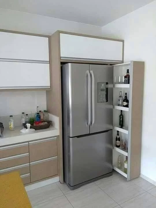 French door refrigerator with organized door shelves holding various bottles and drinks.