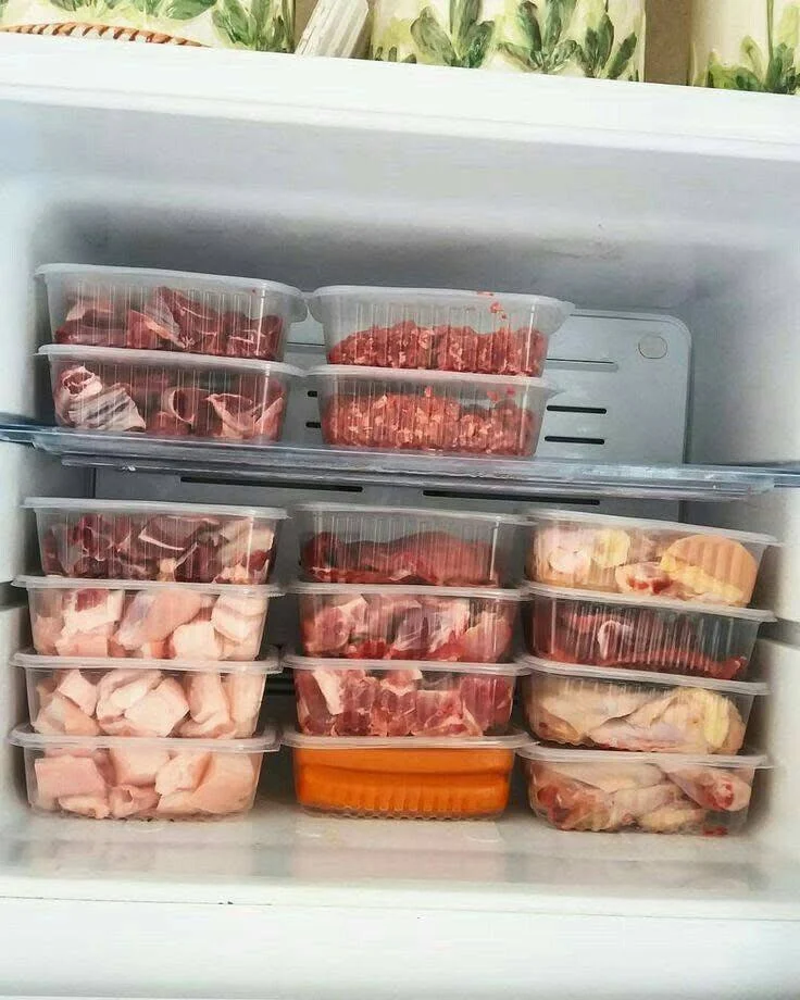 Organized refrigerator with designated areas for dairy (yogurt, milk), drinks, and other food items.