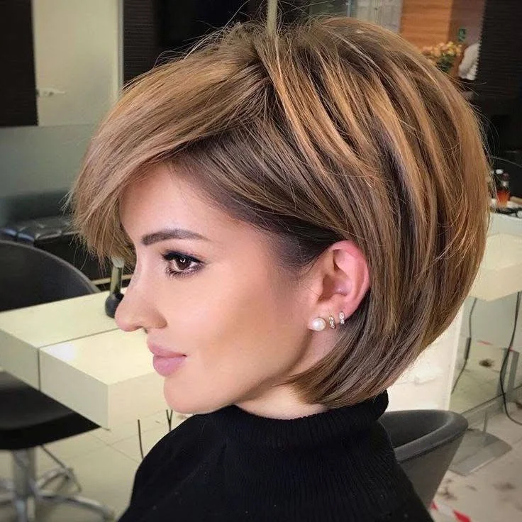 Angled bob with highlights, a dynamic short haircut choice for 2025.