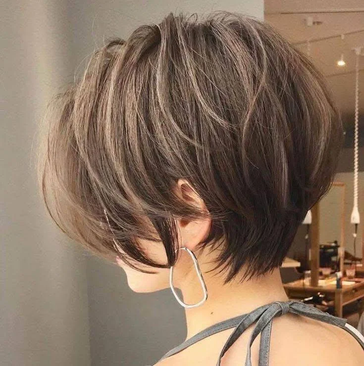 Wispy layered pixie bob, among the trendy short haircuts for 2025.