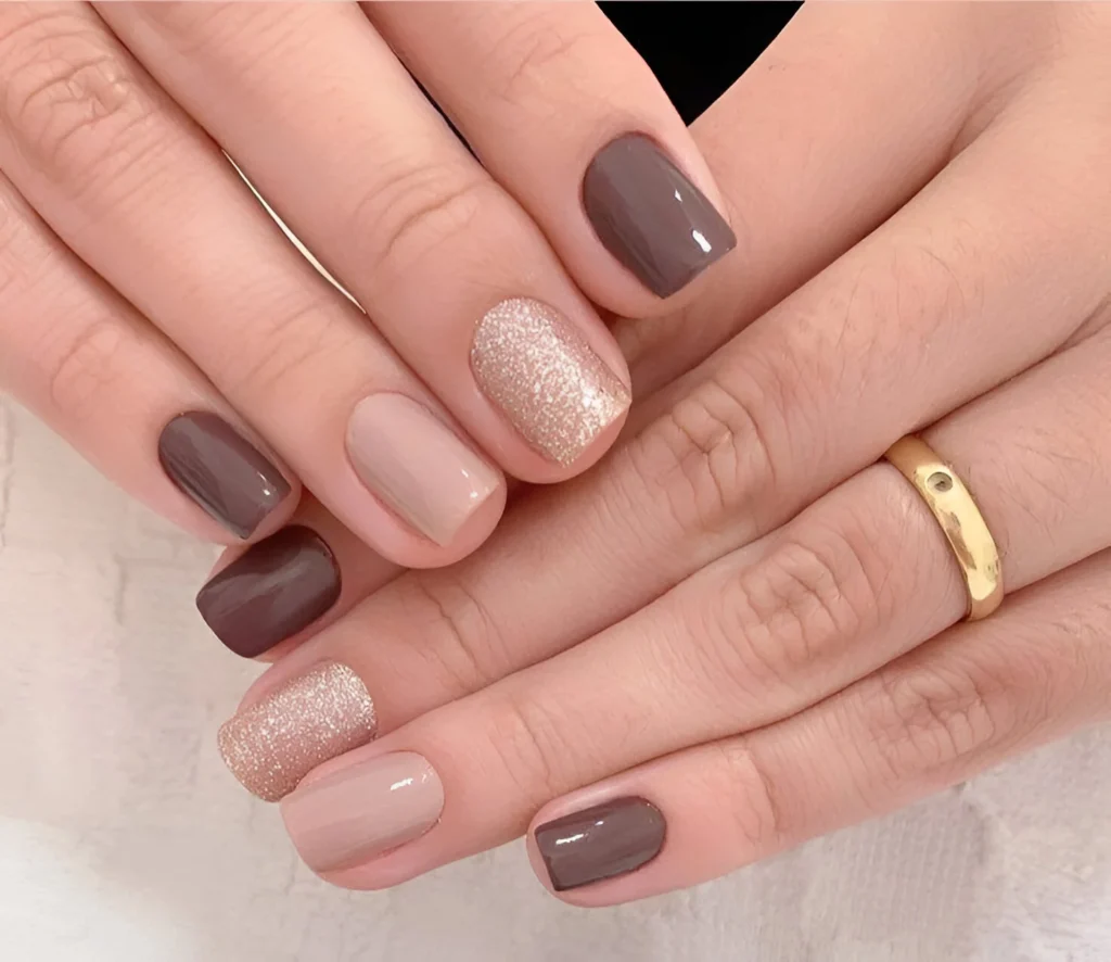 Short nails with beige, brown, and champagne glitter polish - cute short nail designs