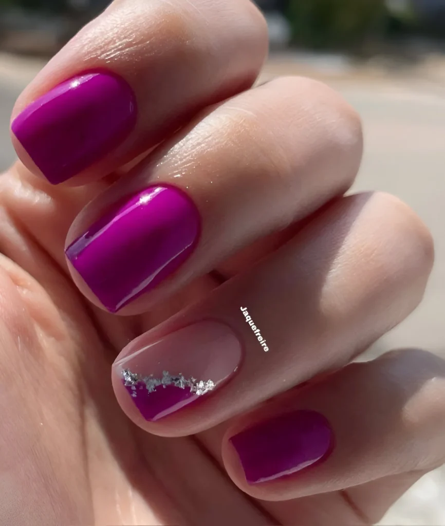 Short nails with fuchsia polish and a nude accent nail with a silver glitter line - cute short nail designs