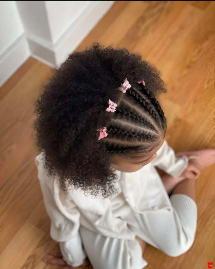 Cute little girl hairstyles; cornrows and afro puff.