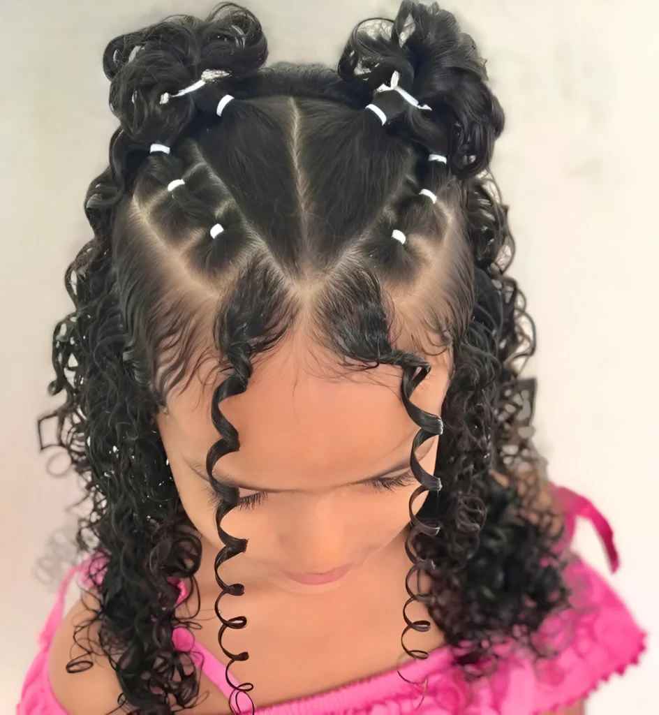 Cute hairstyles for little girls; curly space buns.