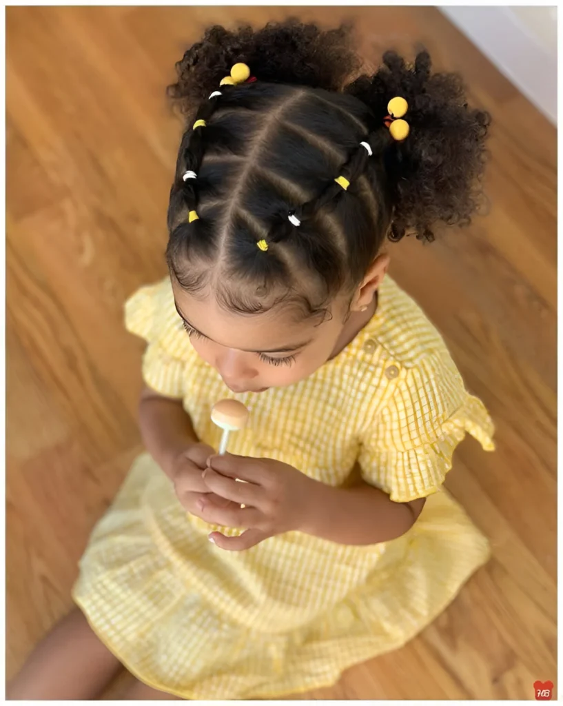 Hairstyles for little girls with curly hair; braided curly puffs.