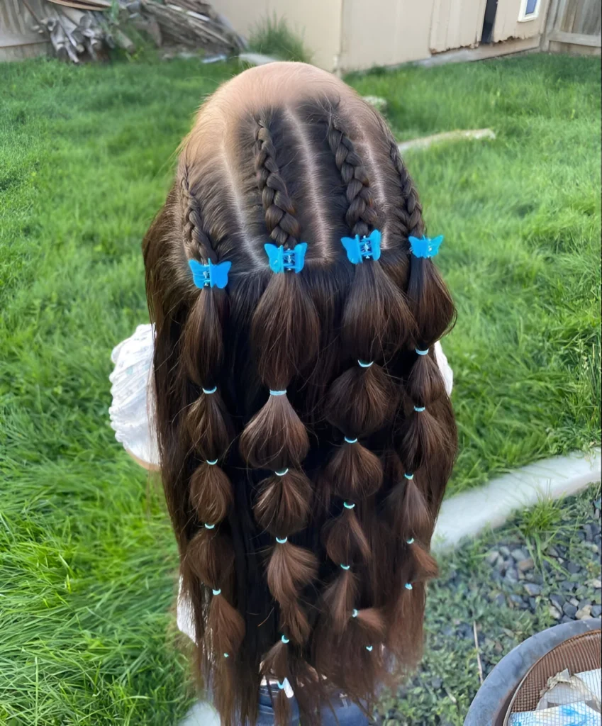 Little girl hairstyle ideas; combination braids with butterfly clips.