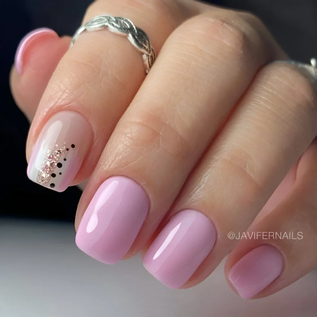 Simple nail designs with pink polish and glitter accent nail.