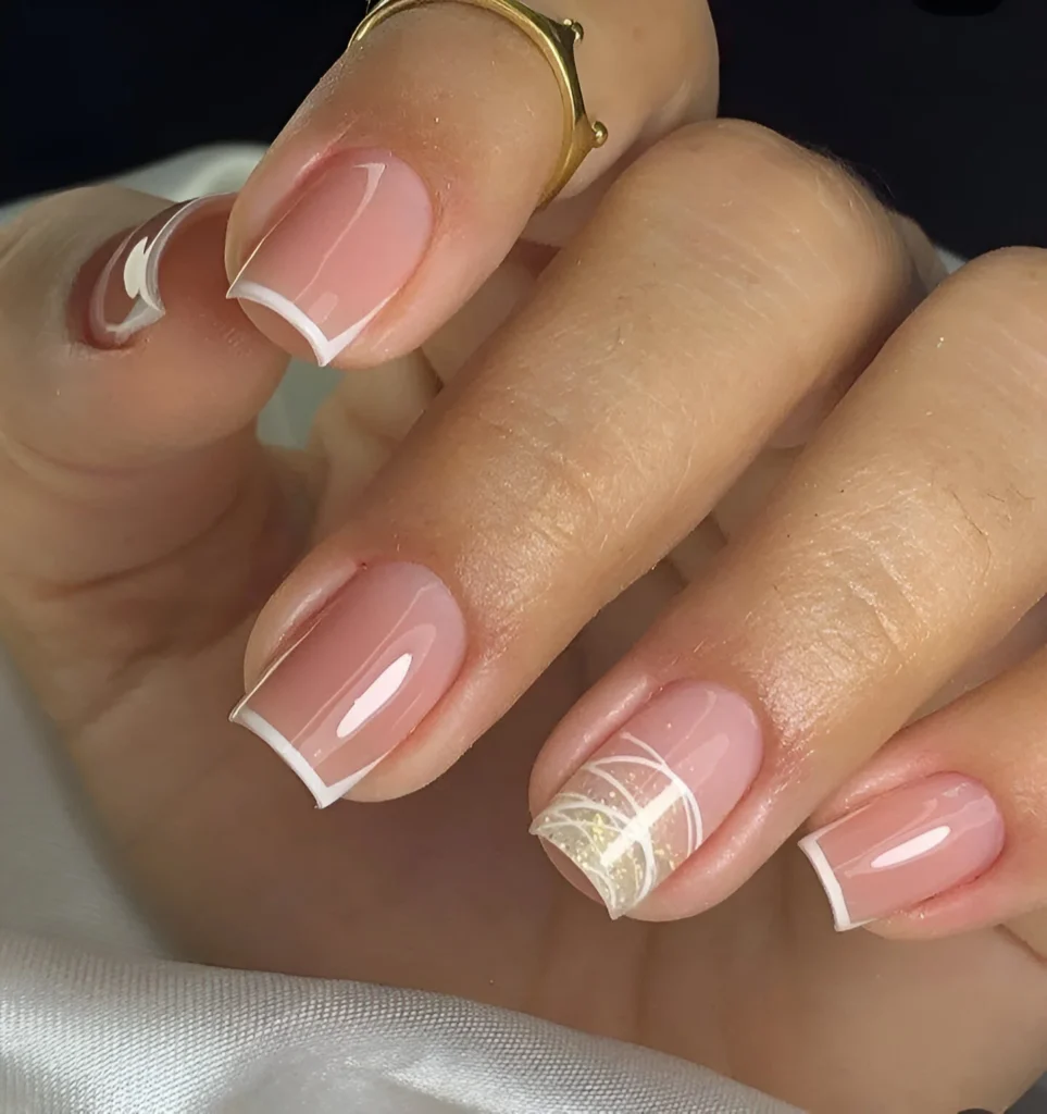 Simple nail designs with abstract white lines and angled French tips.