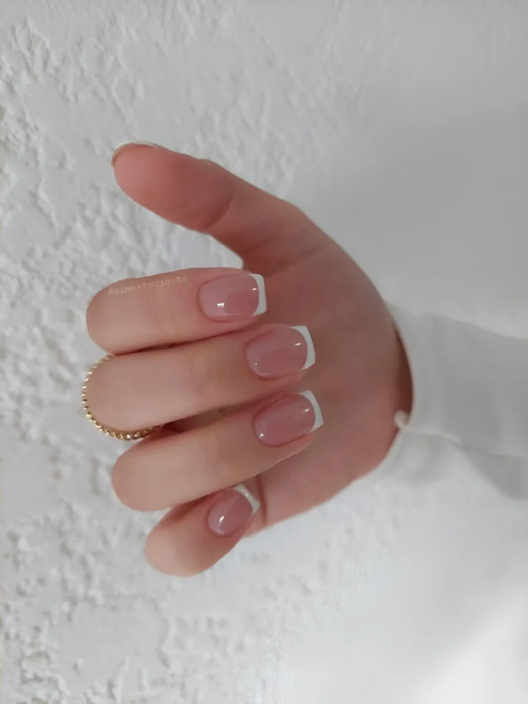 Simple nail designs with very thin French manicure tips.