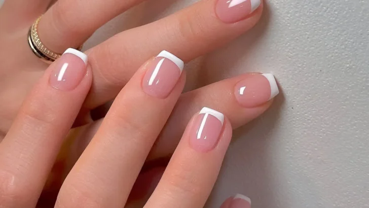 Simple nail designs with varied geometric French manicure tips.