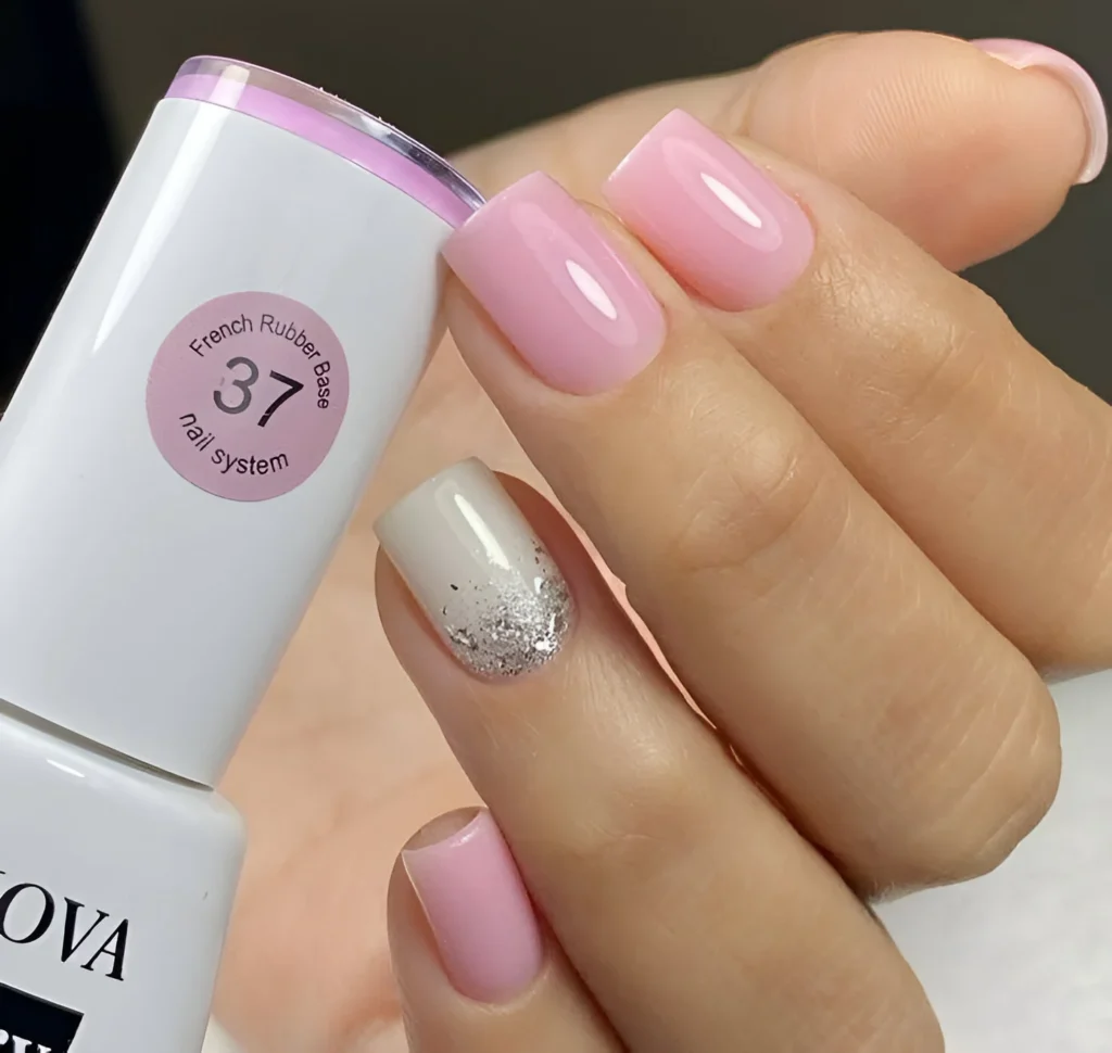 Simple nail designs with pink and silver glitter nails.