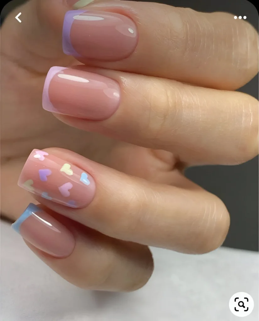 Simple pastel nail designs with French tips and heart accents.