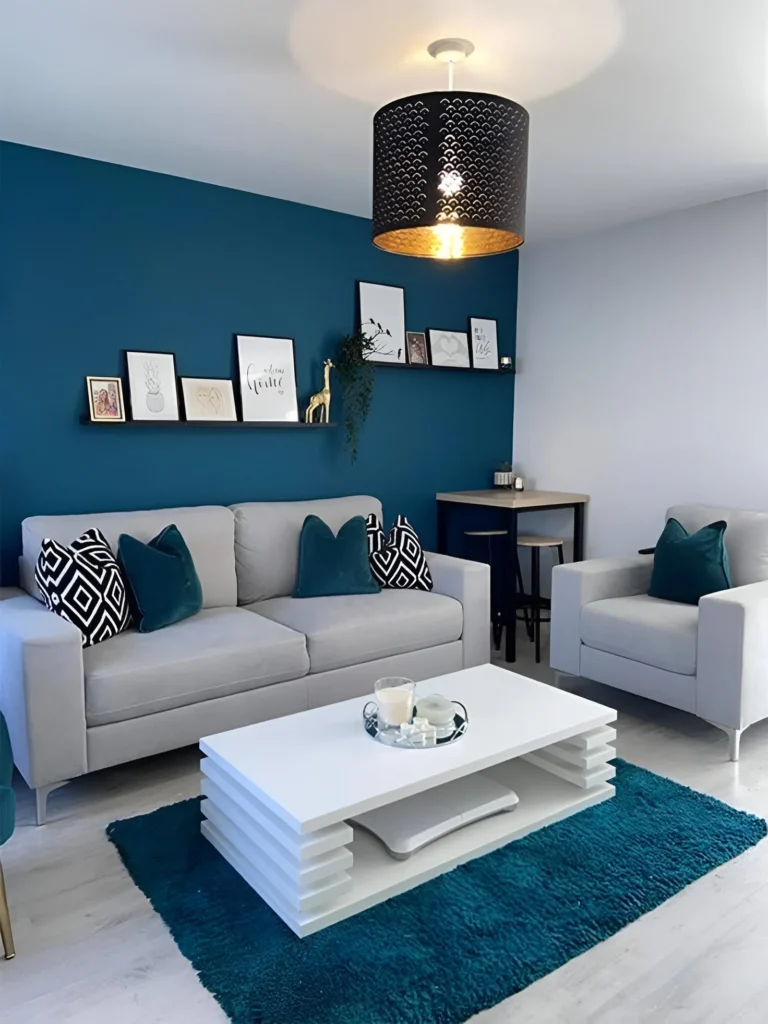 Small living room featuring a bold teal accent wall and modern sofa.