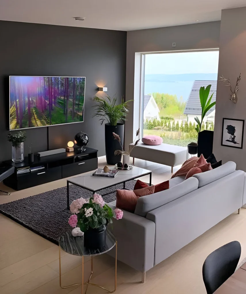 Modern small living room with dark walls, bright accents, and natural light.