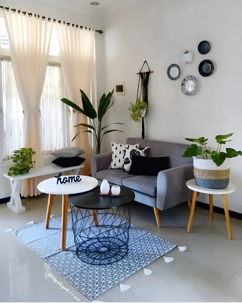 Cozy small living room with neutral tones and layered textures.