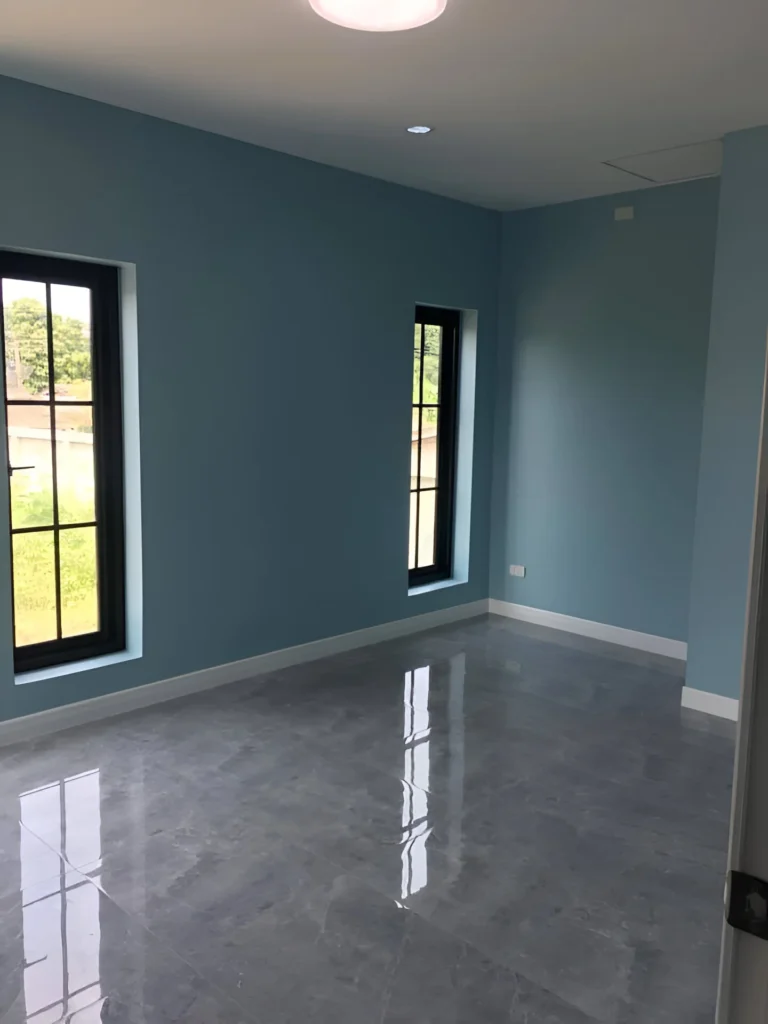 Cool blue accent wall with glossy floors.