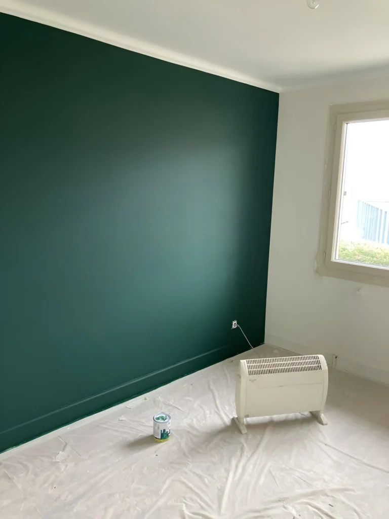 Deep pine green accent wall.