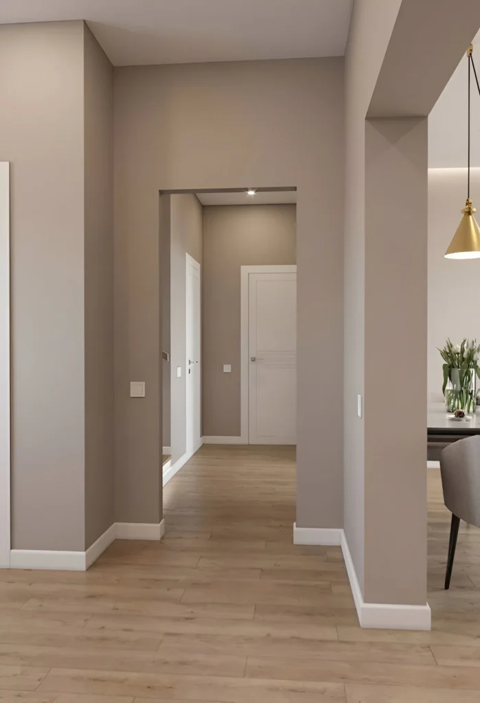 Warm beige accent wall in open hallway.