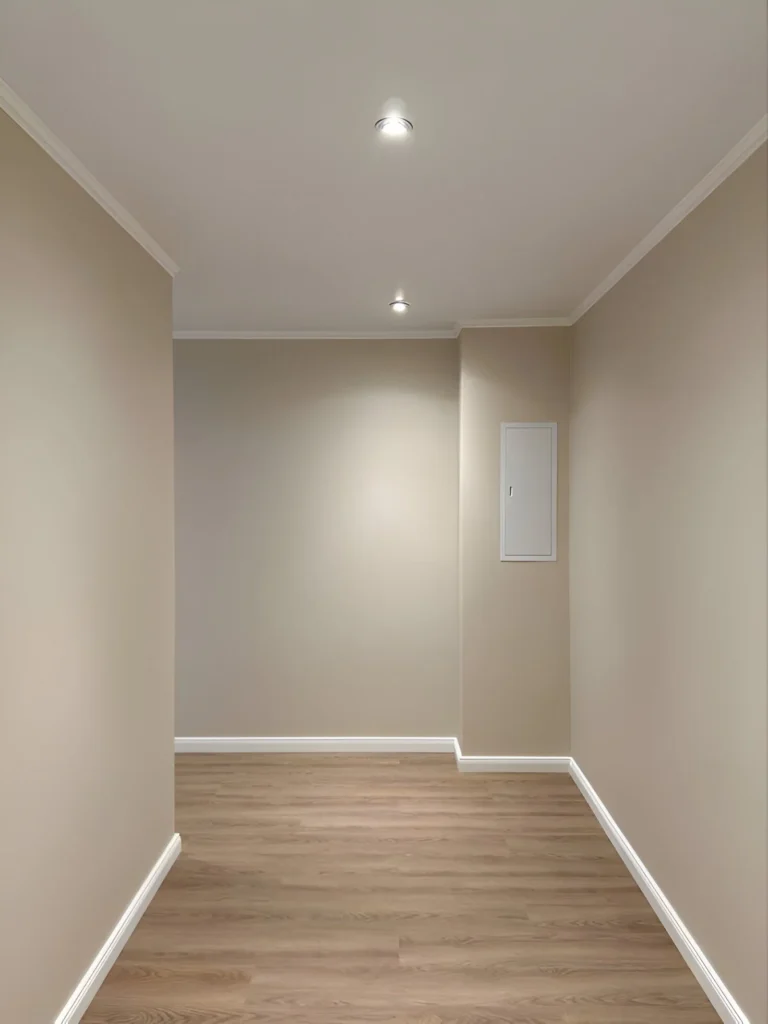 Textured taupe accent wall in hallway.