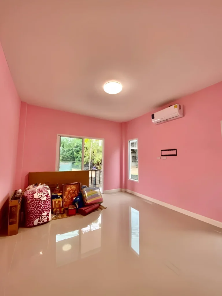 Bright pink accent wall in a modern room.