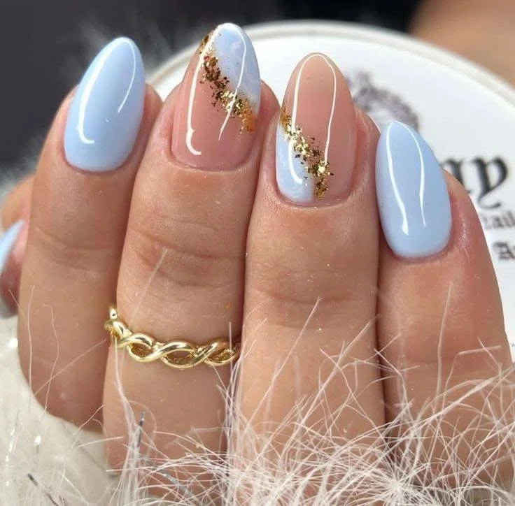 Sky blue nails with nude and gold foil accent nails. trendy nail designs