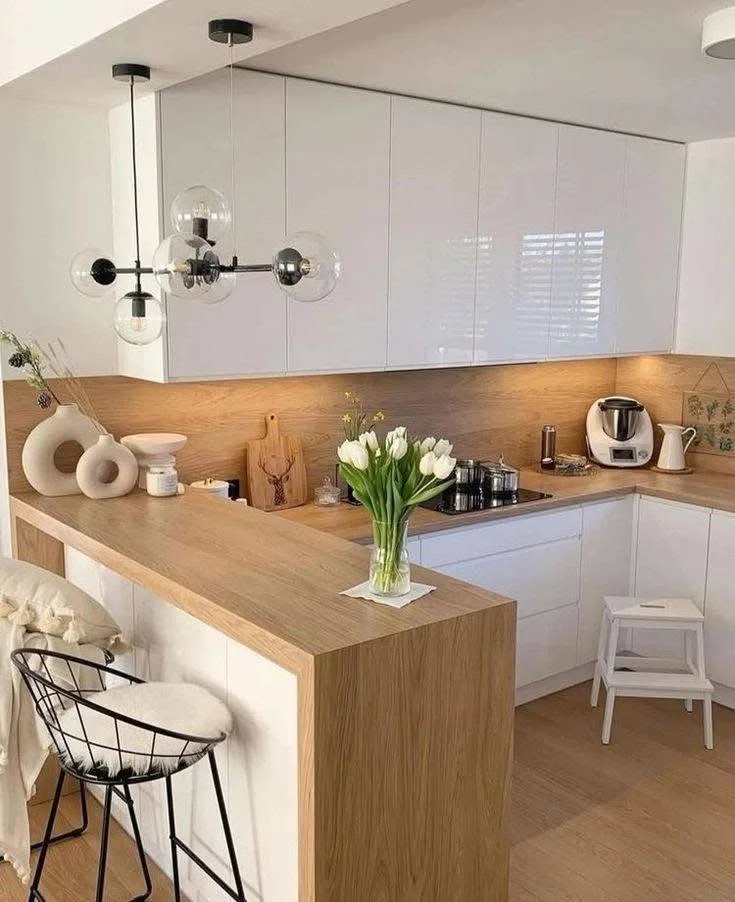 Kitchen with wrap-around wood bar countertop.