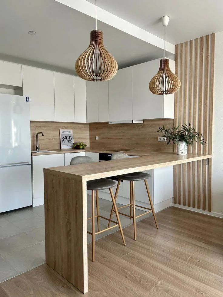 Kitchen with extended wood countertop bar.