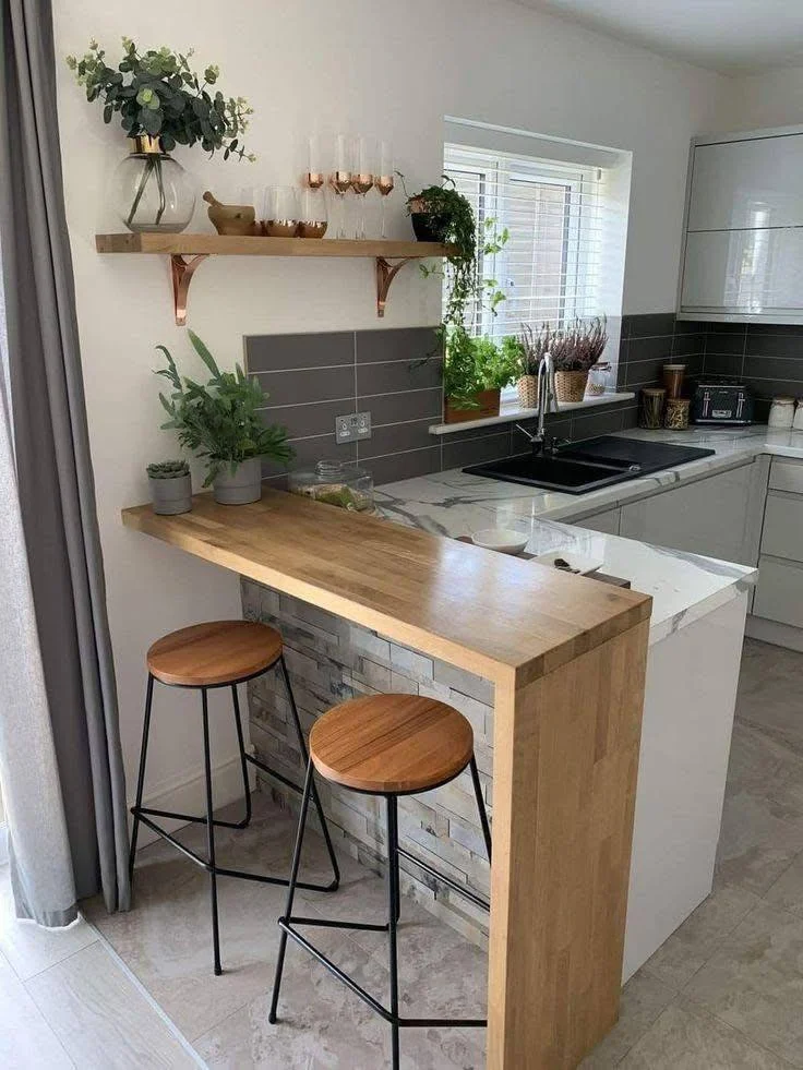 Kitchen island with wood bar extension.