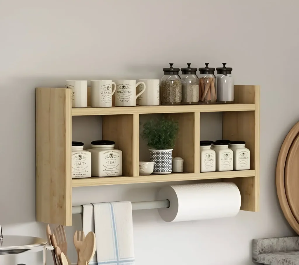 Wall-mounted kitchen shelf with compartments and paper towel holder.