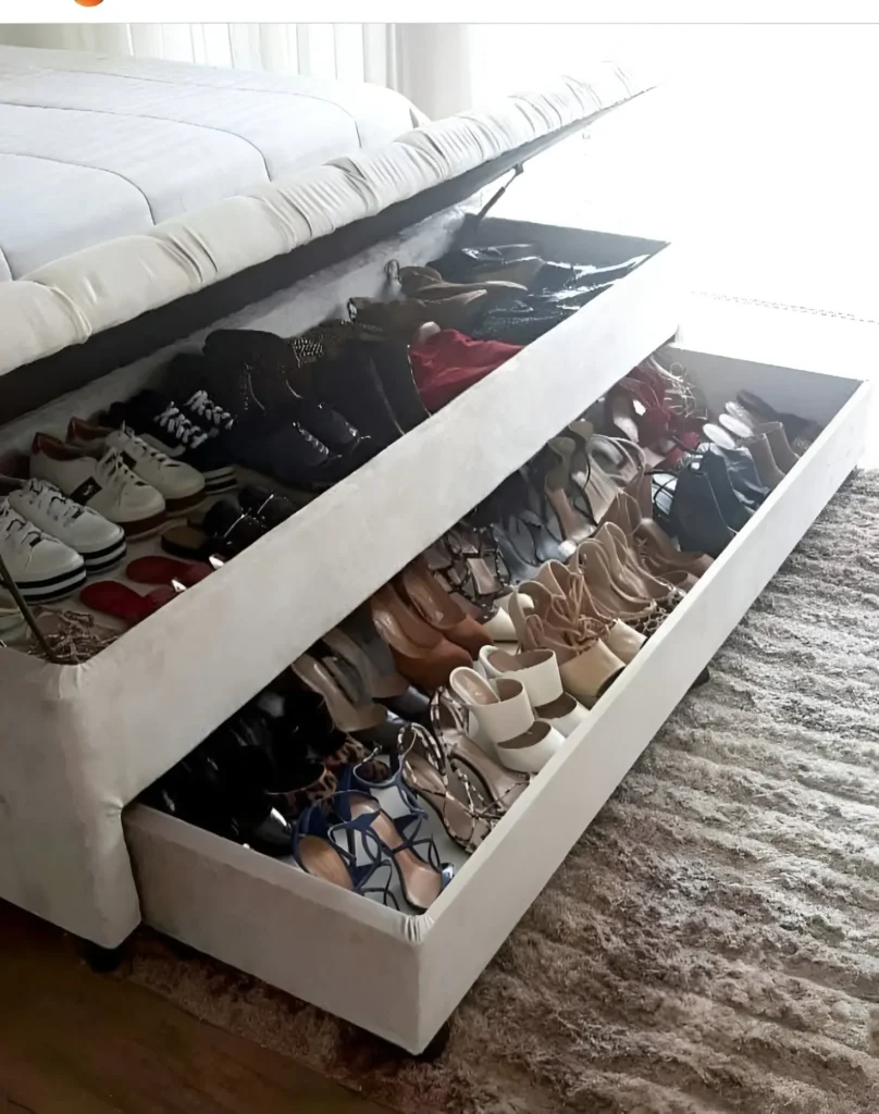 Two-tiered drawer system within a bedroom storage bench for shoes.