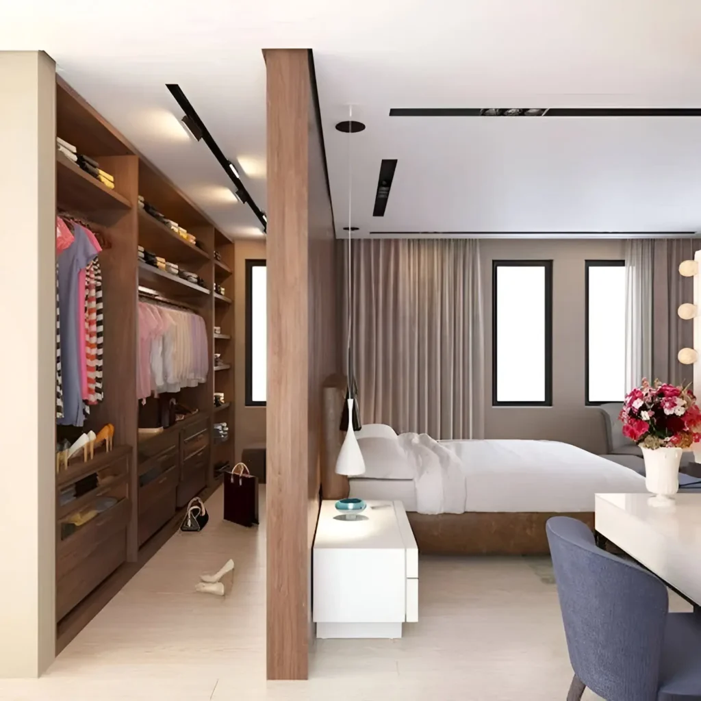 Bedroom with an open-concept closet defined by a partial wall.