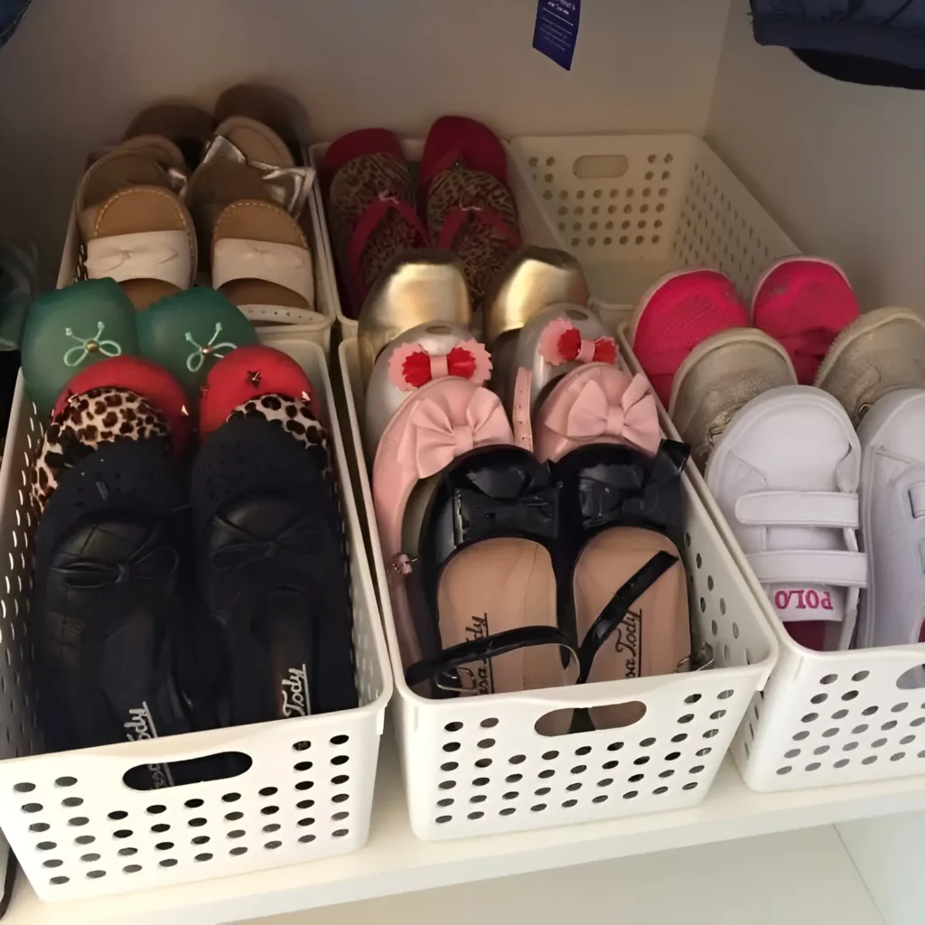 Shoes organized in individual bins on a closet shelf.