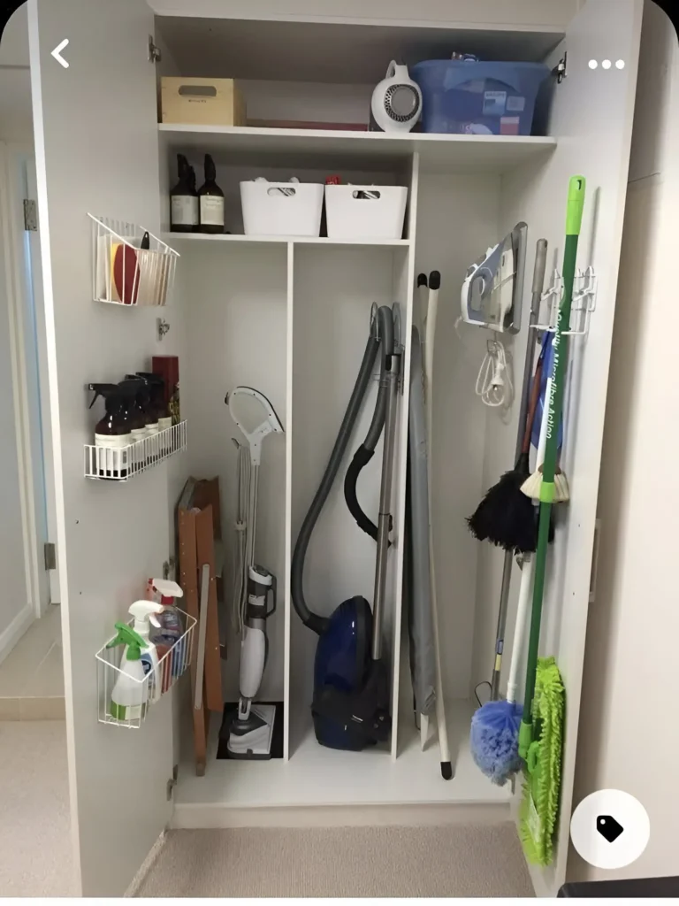 Utility closet with maximized vertical space using shelves, hooks, and brackets.