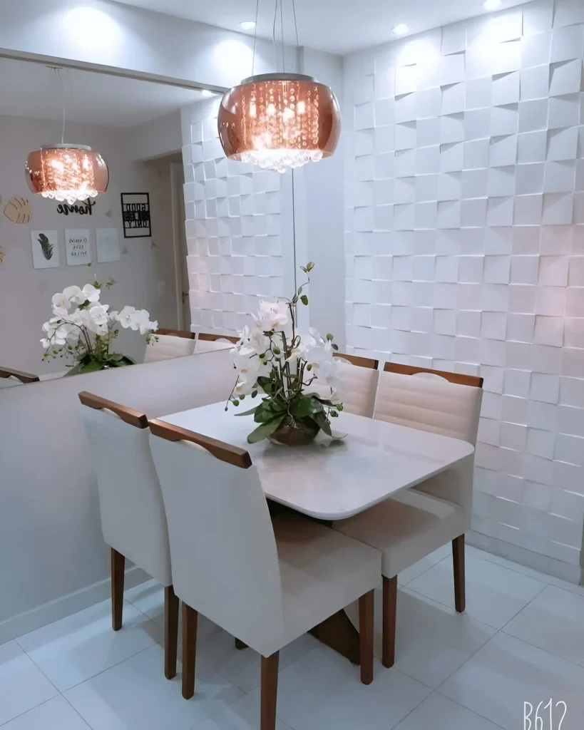 Modern dining area with a textured white accent wall, a large mirror, and elegant pendant lighting.