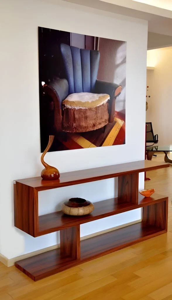 Modern interior featuring bold statement artwork and geometric wooden shelving.